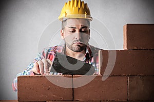 Bricklayer building a wall