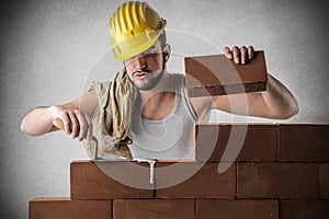 Bricklayer building a wall