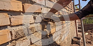 A bricklayer building a wall