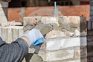 Bricklayer building wall