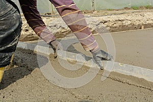 Bricklayer during concreting photo