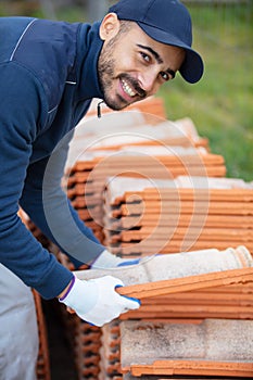 bricklayer industrial worker installing brick masonry