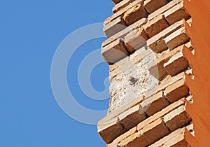 Bricklayer installing bricks on construction site