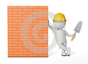 Bricklayer leaning against a new brick wall photo