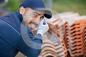 bricklayer worker installing masonry on exterior wall