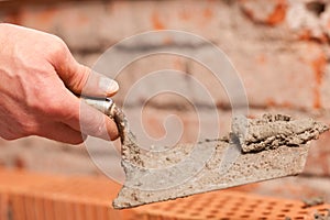 Bricklayer working on construction site