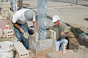 Bricklayers Installing Soldiers photo
