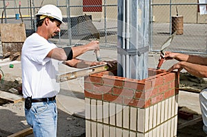 Bricklayers Leveling Bricks photo