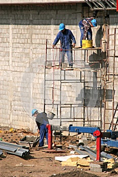 Bricklayers on scaffolding photo