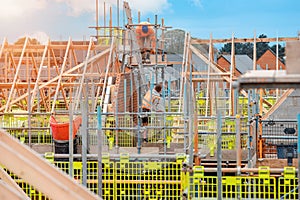 Bricklayers working at height during house roof construction