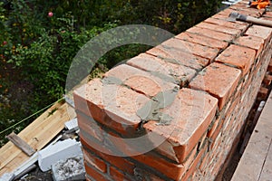 Bricklaying photo. Bricklaying Tips. How to build a brick wall. photo