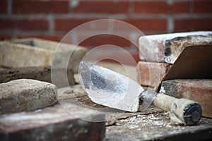 Bricklaying scene with trowel and bricks photo
