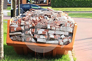 Bricks in a Garbage Dumpster