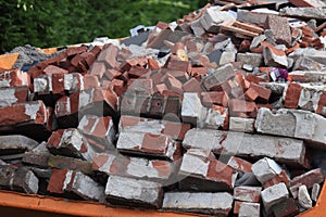 Bricks in a Garbage Dumpster