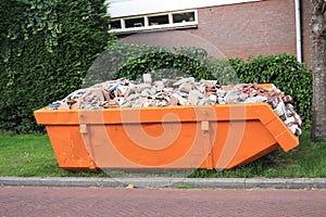 Bricks in a Garbage Dumpster