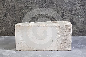 Bricks on the gray concrete background. Copy space. Top view.