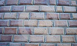 Bricks wall background. Bricks horizontal lines. Red and sand bricks in the wall. Close up of wall with blocks