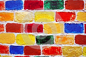 Bricks wall of many colorful painted bricks.