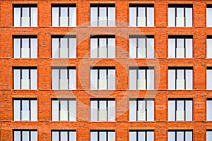 Brickwork facade of a residential building in the loft style.