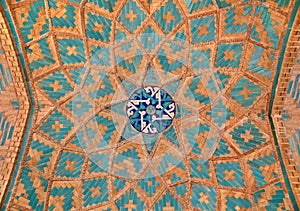 Brickwork mixed with blue tiles inside a mosque