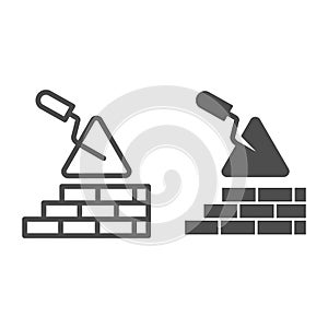 Brickwork and trowel line and solid icon. Spatula tool and building brick wall symbol, outline style pictogram on white