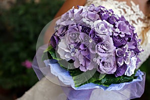 bridal bouquet of artificial purple flowers