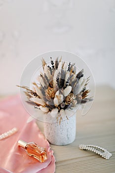 Bridal bouquet and hair accessories. Close-up wedding details. Beauty  fashion blog concept. Stylish feminine accessories flatlay