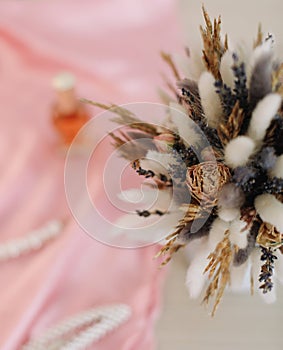 Bridal bouquet and hair accessories. Close-up wedding details. Beauty  fashion blog concept. Stylish feminine accessories flatlay