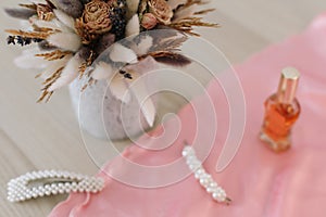 Bridal bouquet and hair accessories. Close-up wedding details. Beauty  fashion blog concept. Stylish feminine accessories flatlay