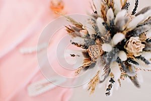 Bridal bouquet and hair accessories. Close-up wedding details. Beauty  fashion blog concept. Stylish feminine accessories flatlay