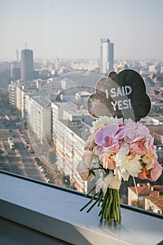 Bridal bouquet with I Said Yes sign