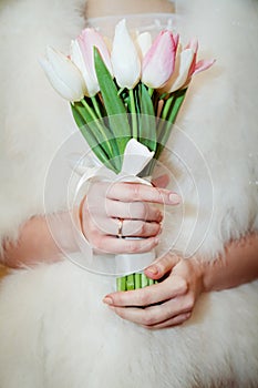 Bridal bouquet with pink tulips in the hands