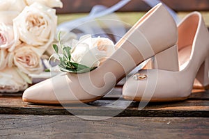 Bridal bouquet posy with wedding shoes and rings. wedding theme background