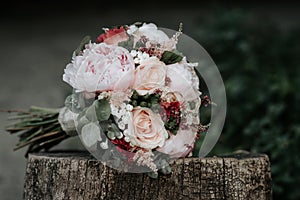 Bridal bouquet of roses with rings. Wedding flowers