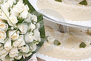 Bridal bouquet and wedding cake