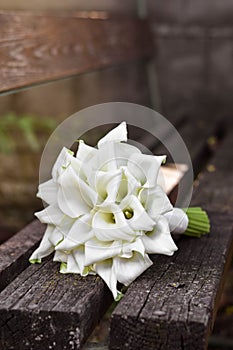 Bridal bouquet of white calla lily. Wedding minimalist flowers. Wedding bouquet