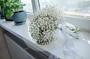 Bridal bouquet of white flowers on a white background