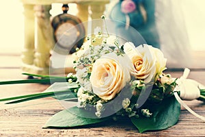 Bridal bouquet of white flowers on wooden surface