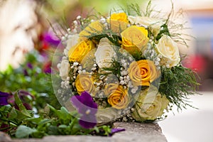 Bridal bouquet of white and yellow roses