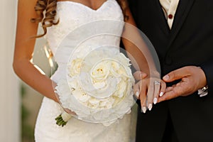 Bridal couple holding hands