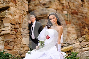 Bridal couple posing outdoor on their wedding day