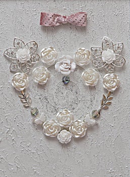 Bridal flowers in heart shape closeup on elegant white