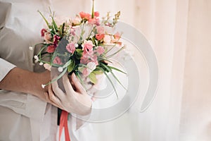 A bridal holding beautiful bouquet, wedding or love concept