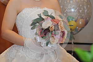 Bridal image, a wonderfully elegant and very nice event reception with a bride holding a bouquet bouquet