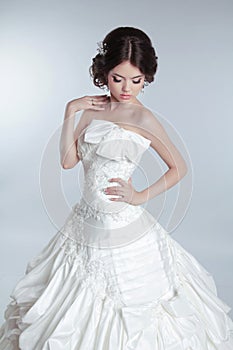 Bridal makeup, hairstyle. Beautiful charming bride in wedding lu