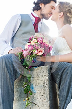 Bridal pair kissing after wedding