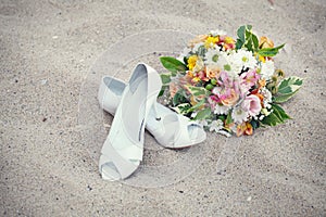 Bridal shoes and wedding bouquet