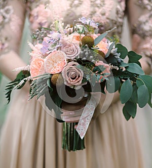 Bride with a beautiful purple wedding bouquet