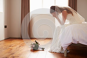 Bride In Bedroom Having Second Thoughts Before Wedding