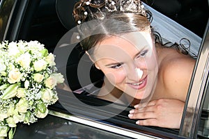 Bride in black car.